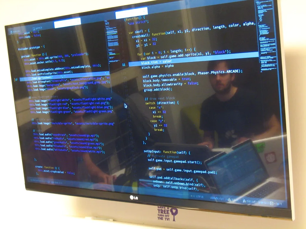 Colorful syntax-highlighted source code on a monitor