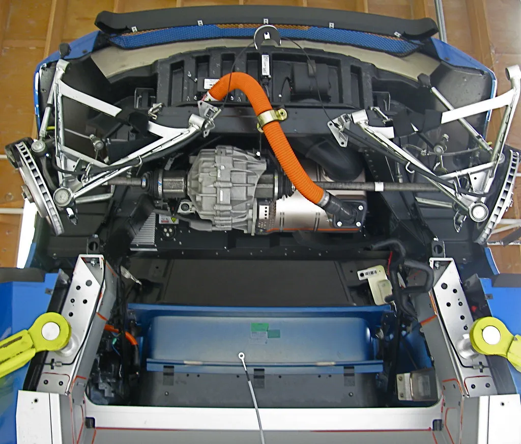 An electric vehicle drivetrain with an orange high-voltage cable